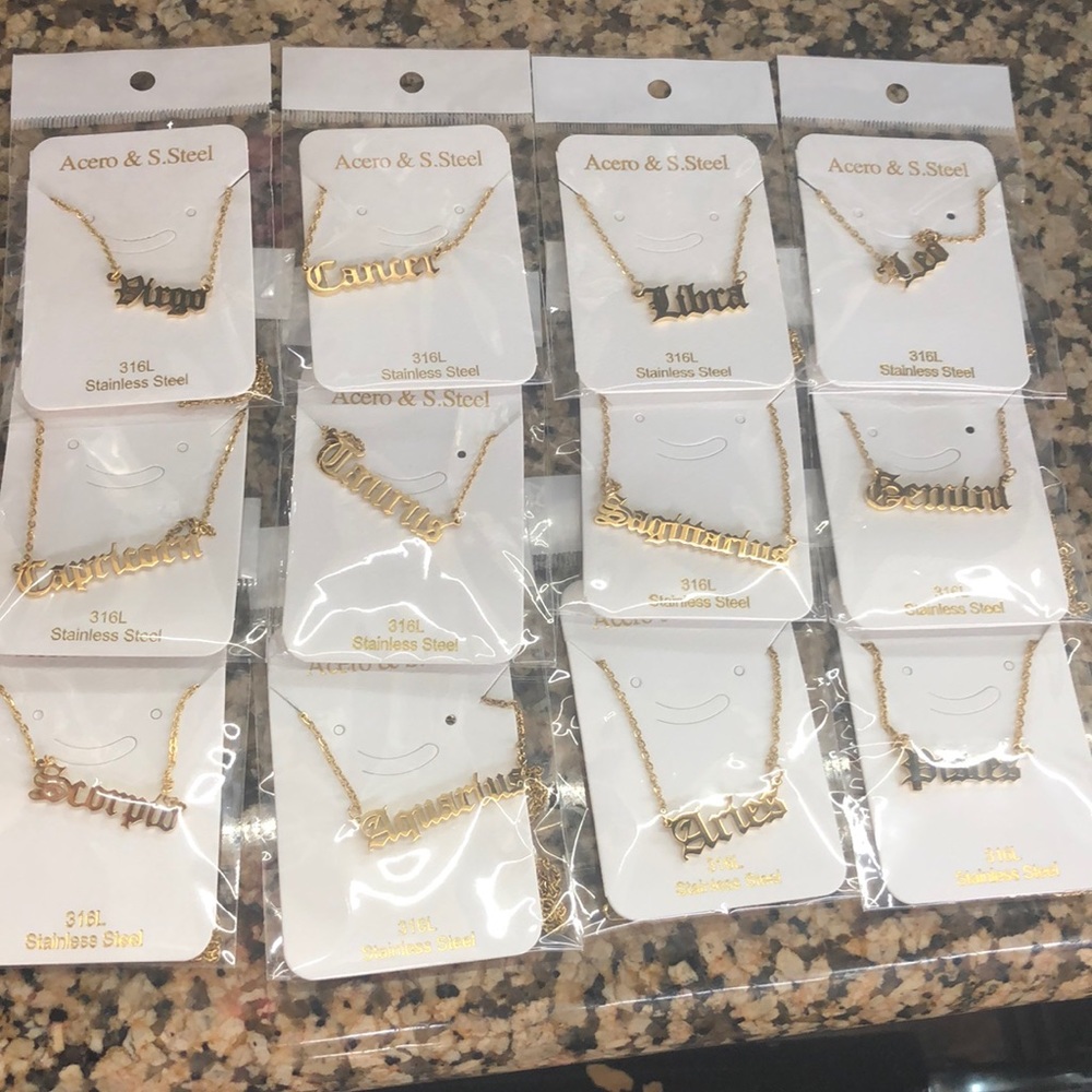 Horoscope gold plated name plates.